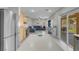 Spacious living area features light gray flooring, a comfortable sofa, and backyard access through a sliding glass door at 5228 Giallo Vista Ct, North Las Vegas, NV 89031