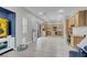 Open floorplan showcasing the living room that flows into the kitchen, with a water cooler at 5228 Giallo Vista Ct, North Las Vegas, NV 89031
