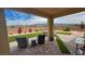 Backyard patio area with outdoor seating, artificial turf, and a mountain view at 5528 Eleganza Ave, Pahrump, NV 89061