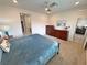 Bedroom with an ensuite bathroom, spacious layout, carpet, and modern furnishings at 5528 Eleganza Ave, Pahrump, NV 89061