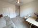 Bright bedroom setup as den featuring a sofa, a desk, and closet at 5528 Eleganza Ave, Pahrump, NV 89061