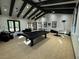 Spacious clubhouse interior with a billiards table, cozy seating, and modern ceiling fans at 5528 Eleganza Ave, Pahrump, NV 89061