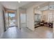 Spacious foyer with tile flooring and a view of the open-concept layout of the home at 5528 Eleganza Ave, Pahrump, NV 89061