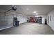 Three car garage with ample space for vehicles and storage, featuring multiple garage door openers at 5528 Eleganza Ave, Pahrump, NV 89061