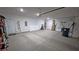 Spacious garage with ample room for vehicles and storage, featuring a convenient side entry door at 5528 Eleganza Ave, Pahrump, NV 89061