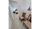 Hallway with a view of a bedroom featuring neutral walls, carpet, and a decorative metal tree wall hanging at 5528 Eleganza Ave, Pahrump, NV 89061