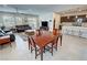 Open concept living space with a dining table and adjacent living room, great for entertaining at 5528 Eleganza Ave, Pahrump, NV 89061