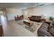 Open-concept living space with a dining area, living room featuring comfortable seating, and modern furnishings at 5528 Eleganza Ave, Pahrump, NV 89061