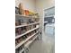 Spacious pantry featuring organized shelves and ample storage space, conveniently located near the kitchen at 5528 Eleganza Ave, Pahrump, NV 89061