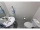 Cozy powder room featuring a pedestal sink, neutral walls, and tiled floors at 5528 Eleganza Ave, Pahrump, NV 89061
