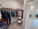 Spacious walk-in closet with organized storage and convenient access to the bathroom at 5528 Eleganza Ave, Pahrump, NV 89061