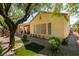 View of a well-maintained backyard with artificial grass and a covered patio at 561 Carmel Valley St, Henderson, NV 89012