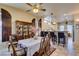 Charming dining space with a dining table, a china cabinet and a breakfast bar into the kitchen at 561 Carmel Valley St, Henderson, NV 89012