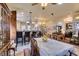 Elegant dining room featuring a table set for a meal and decorative accents, next to the open plan kitchen at 561 Carmel Valley St, Henderson, NV 89012