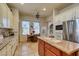 Bright eat-in kitchen features an island, stainless steel appliances, and a cozy dining area for casual meals at 561 Carmel Valley St, Henderson, NV 89012