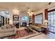 Comfortable living room with a stone fireplace and built-in shelves, creating a cozy atmosphere at 561 Carmel Valley St, Henderson, NV 89012