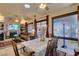 Bright living space with an open layout featuring a living room, dining area, and stone fireplace at 561 Carmel Valley St, Henderson, NV 89012