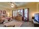 Spacious main bedroom with plush carpet, ceiling fan, and natural light from windows at 561 Carmel Valley St, Henderson, NV 89012