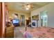 Inviting main bedroom with fireplace, carpet, and natural light from windows at 561 Carmel Valley St, Henderson, NV 89012
