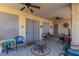 Relaxing covered patio featuring tiled flooring, ceiling fans, and comfortable seating area at 561 Carmel Valley St, Henderson, NV 89012