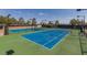 Well-maintained outdoor tennis courts with pristine blue surfaces and professional lighting at 561 Carmel Valley St, Henderson, NV 89012