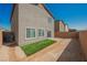 View of the home's backyard and patio area, enclosed with a brick privacy wall at 6148 Vista Teal Ln, Las Vegas, NV 89115