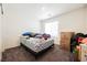 Bedroom with carpeted floors and a bed covered in items, some packed boxes nearby at 6148 Vista Teal Ln, Las Vegas, NV 89115