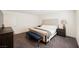 This spacious bedroom has a queen bed with bench seating and neutral color tones throughout at 6148 Vista Teal Ln, Las Vegas, NV 89115