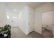 Bright entryway with neutral tile flooring and a half bath on the side at 6148 Vista Teal Ln, Las Vegas, NV 89115