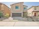 Inviting two-story home with a modern design and a neatly paved driveway at 6148 Vista Teal Ln, Las Vegas, NV 89115