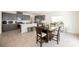 Stylish open kitchen with gray cabinetry, modern appliances, and a central island at 6148 Vista Teal Ln, Las Vegas, NV 89115