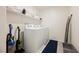 Bright laundry room featuring a white washer and dryer, with built-in storage shelves above at 6148 Vista Teal Ln, Las Vegas, NV 89115
