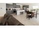 Bright, open-concept space featuring a modern kitchen, dining area, and comfortable living area at 6148 Vista Teal Ln, Las Vegas, NV 89115