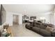 Spacious living room featuring tile floors, neutral walls, and an open-concept layout at 6148 Vista Teal Ln, Las Vegas, NV 89115