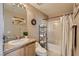 Bathroom featuring tiled shower and granite countertop vanity at 63 E Agate Ave # 509, Las Vegas, NV 89123