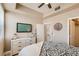 Bedroom featuring ceiling fan, closet and dresser at 63 E Agate Ave # 509, Las Vegas, NV 89123