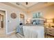 Inviting bedroom featuring a ceiling fan, closet, and bedside tables at 63 E Agate Ave # 509, Las Vegas, NV 89123
