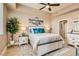 Comfortable bedroom with a large window, ceiling fan, and neutral décor at 63 E Agate Ave # 509, Las Vegas, NV 89123