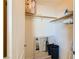 Organized closet with shelves, hanging rods, and mirror, maximizing storage space at 63 E Agate Ave # 509, Las Vegas, NV 89123