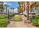 Outdoor area with a grassy area, benches, and lush greenery, creating a relaxing setting at 63 E Agate Ave # 509, Las Vegas, NV 89123