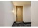 Inviting entryway features a classic door with modern hardware and updated lighting at 63 E Agate Ave # 509, Las Vegas, NV 89123