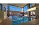 Resort-style indoor pool area with floor-to-ceiling windows and comfortable lounge seating at 63 E Agate Ave # 509, Las Vegas, NV 89123