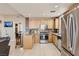 Bright kitchen features stainless steel appliances, granite counters, and breakfast bar seating at 63 E Agate Ave # 509, Las Vegas, NV 89123