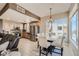 Open kitchen and dining area features stainless steel appliances and natural light from a large window at 63 E Agate Ave # 509, Las Vegas, NV 89123