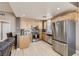 Modern kitchen boasting stainless steel appliances, granite countertops, and light wood cabinetry at 63 E Agate Ave # 509, Las Vegas, NV 89123