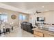 Open-concept living room showcases a dining area and balcony access with mountain views at 63 E Agate Ave # 509, Las Vegas, NV 89123