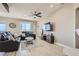 Open living room features recessed lighting, ceiling fan, and a large window with neighborhood views at 63 E Agate Ave # 509, Las Vegas, NV 89123