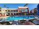 Community pool area with lounge chairs and well maintained landscaping at 63 E Agate Ave # 509, Las Vegas, NV 89123