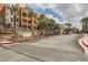 Community entrance with lush landscaping and signage at 63 E Agate Ave # 509, Las Vegas, NV 89123
