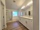 Spacious bathroom with double vanity and separate shower and tub at 6638 Babys Tear Pl, Las Vegas, NV 89148
